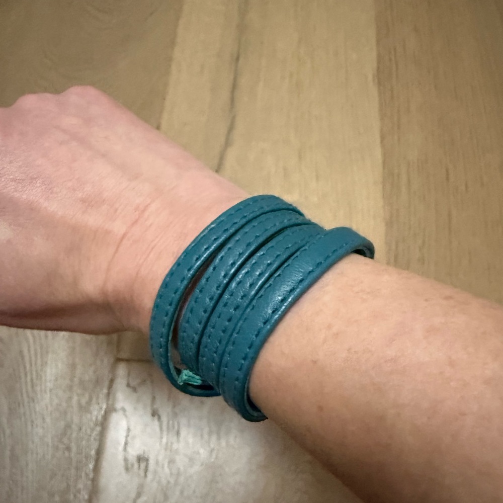 Pretty teal leather wrap bracelet. Long so can wrap many times around wrist.